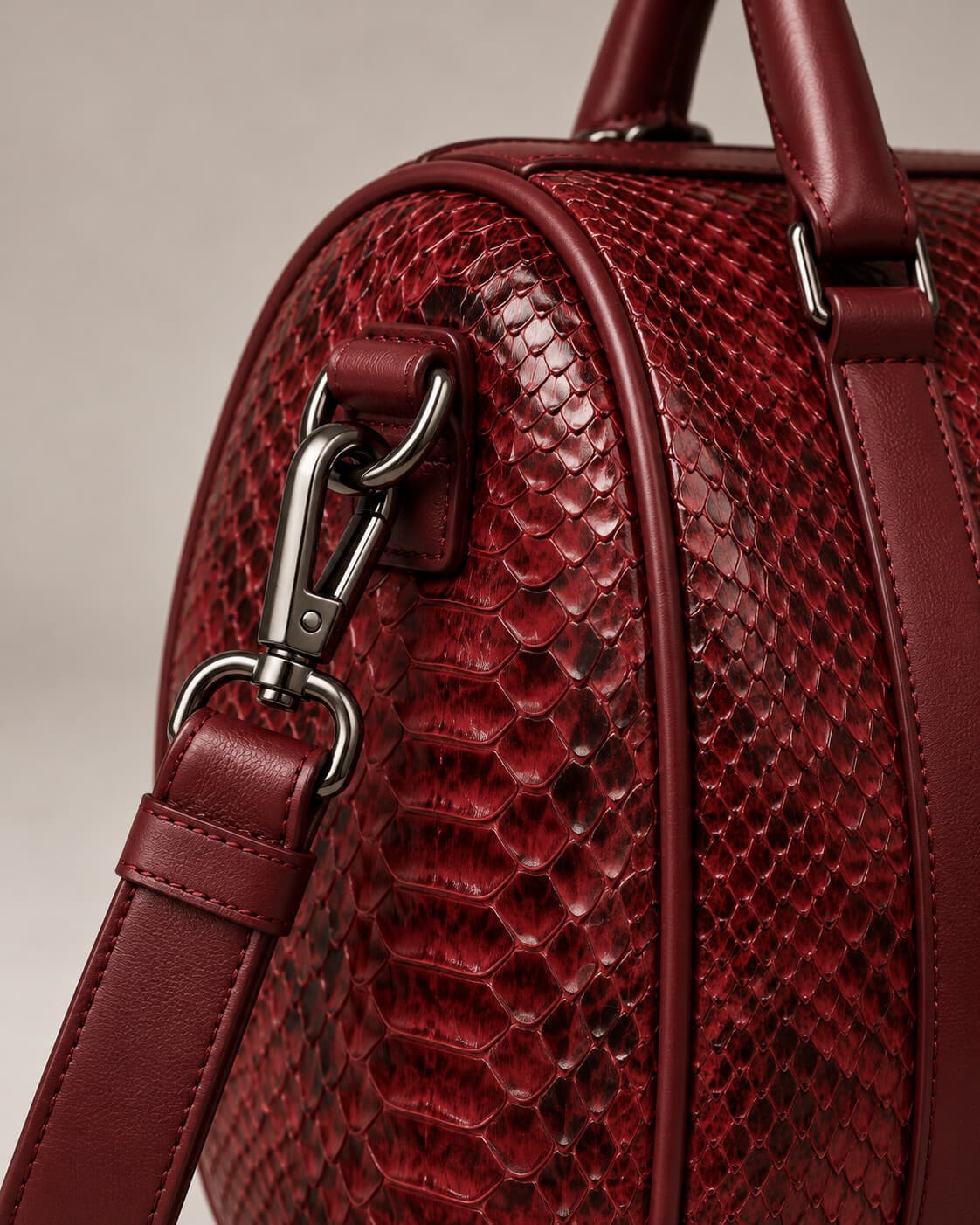 The Dom Bag in Burgundy python, hardware detail