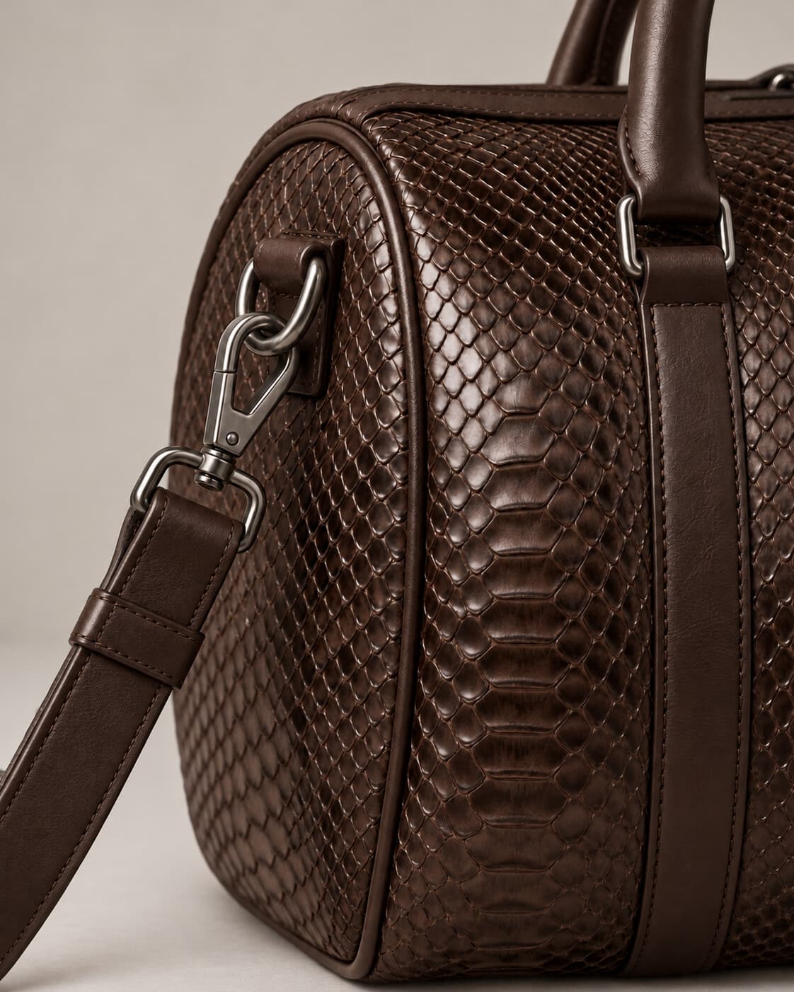The Dom Bag in Chocolate Brown python, hardware detail